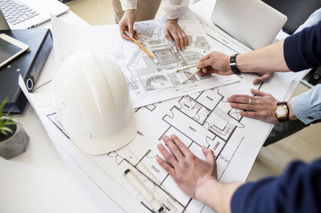 architects-engineer-discussing-table-with-blueprint_23-2147842977 architects-engineer-discussing-table-with-blueprint_23-2147842977